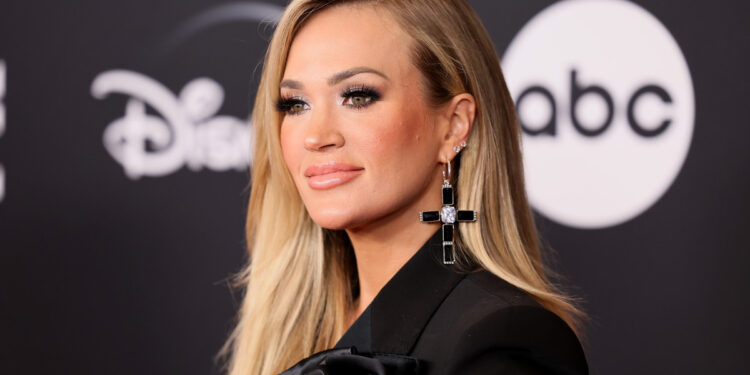 Carrie Underwood Shows Off ‘America’s Finest Legs’ in Blue Jean Shorts After Tumbling Onstage